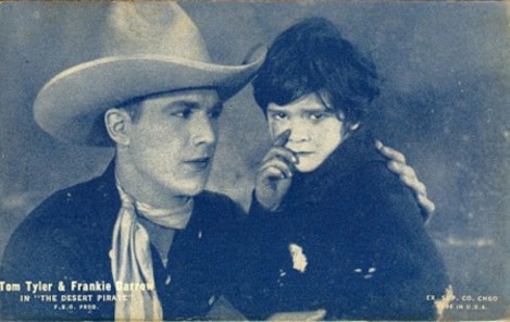 Tom Tyler and Frankie Darro in The Desert Pirate arcade card
